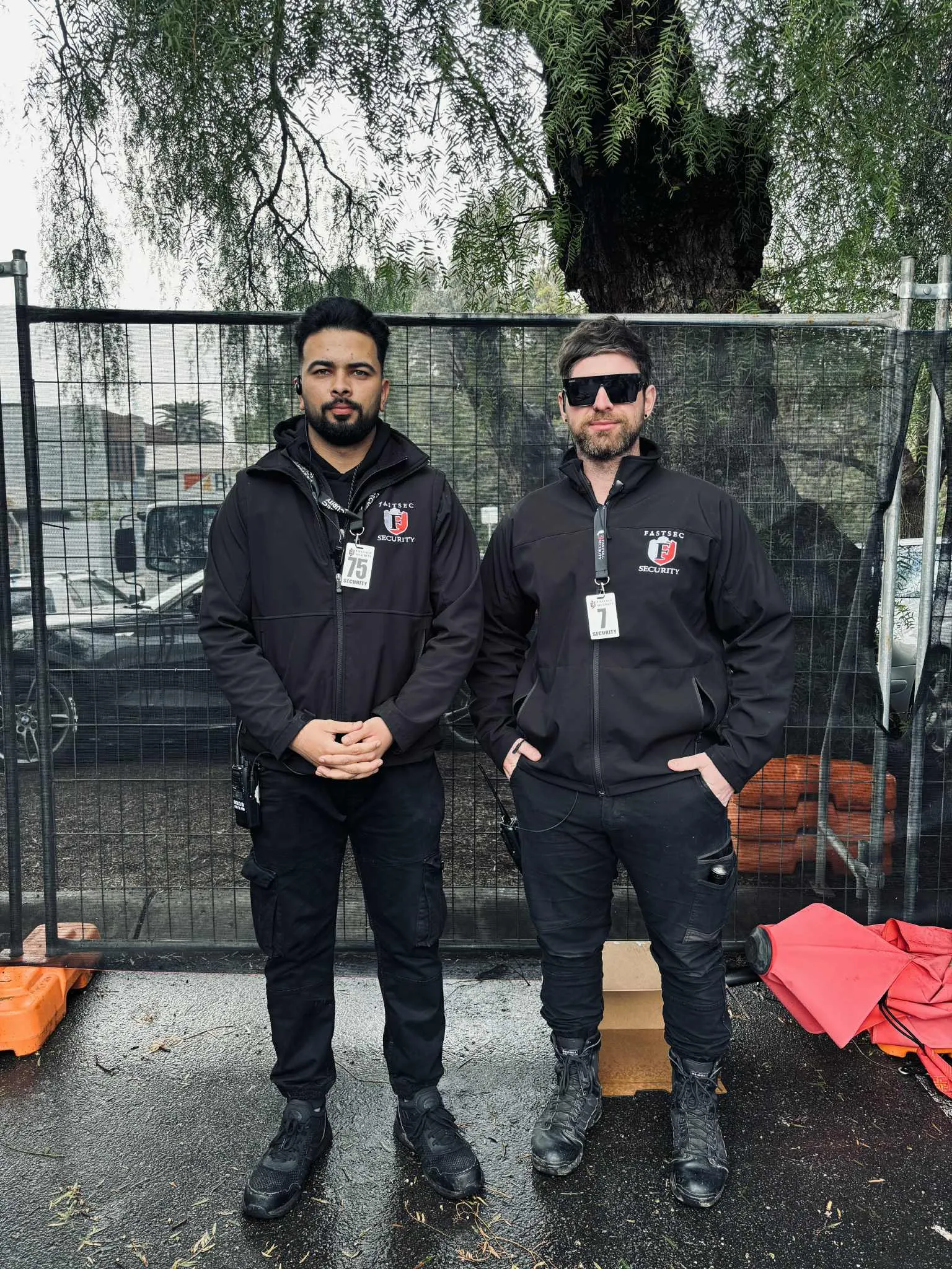 Static guards posted at a construction site gate controlling access